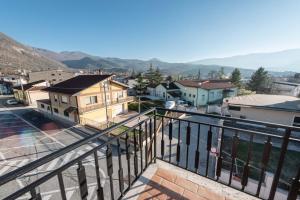 a view of a city from a balcony at Il Risveglio del Cavaliere Casa Vacanza in Gioia dei Marsi