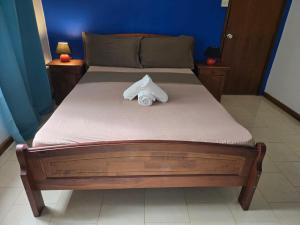a bed with a towel on top of it at sea view in Pereybere