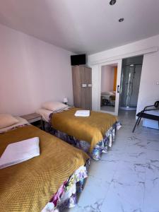 Posteľ alebo postele v izbe v ubytovaní Stilo Hotel