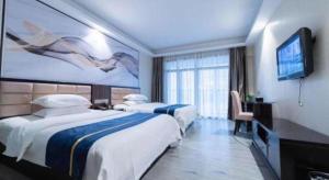 Postel nebo postele na pokoji v ubytování Oriental Hotel