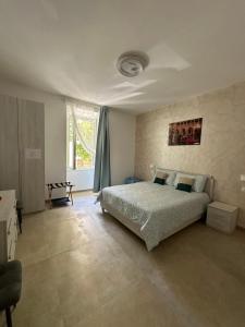 a bedroom with a bed in the middle of it at YouRoominRome in Rome