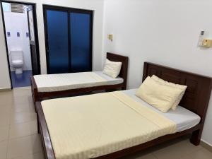Voodi või voodid majutusasutuse East Gate 8-9 Batticaloa toas