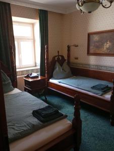 Voodi või voodid majutusasutuse hotel Memorial toas