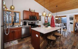 a kitchen with wooden cabinets and a counter top at Majestic Getaway 1427 in Gatlinburg