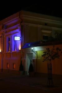 a building with colored lights on it at night at Konak Požarevac in Požarevac