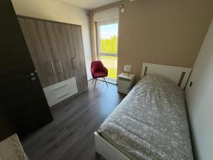 Ένα ή περισσότερα κρεβάτια σε δωμάτιο στο Appartement attique