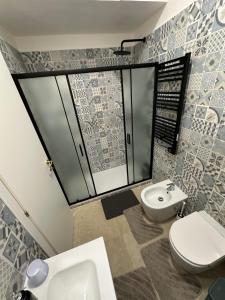 a bathroom with a toilet and a sink at YouRoominRome in Rome +20 photos