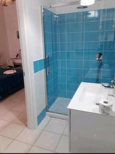 a bathroom with a glass shower and a sink at Residenza d'epoca Olimpia in Santa Maria di Castellabate