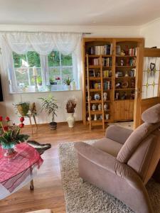 a living room with a couch and a table at FeWo Auszeit Andreas Schreiner in Arrach