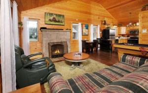 a living room with a couch and a fireplace at Skinny Dipping in Gatlinburg