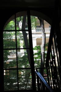 a view of a tree from a window at Fanni Budapest Guesthouse in Budapest