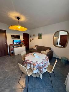 a living room with a table and a couch at Casa Janas, Palau, Costa Smeralda in Palau
