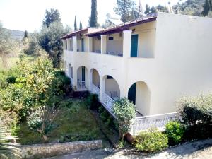 a villa with a view of the house at Villa Thomas in Agios Georgios Pagon