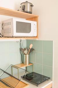 Kuchyň nebo kuchyňský kout v ubytování Cosy - 2pers - Proche front de mer - By Sister Home