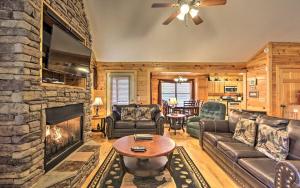 a living room with a couch and a fireplace at Gatlinburg Mountain Heaven Retreat in Gatlinburg