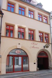 a building with a sign that reads mol is morgan at Hotel garni St. Marien in Naumburg