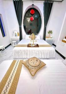 En eller flere senge i et værelse på Hoàng Nga 1 Homestay