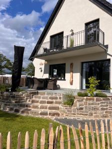 a house with a stone staircase in front of it at Ferienhaus AhrIdylle in Bad Neuenahr-Ahrweiler