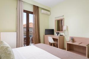 Televizors / izklaižu centrs naktsmītnē Hotel Leto Delphi