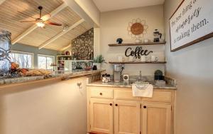 a kitchen with a counter and a sink at Vista Haven - Mountain Views and Fireplace and Big Screen TVs and Extras in Jasper