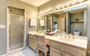 a bathroom with a sink and a mirror at Vista Haven - Mountain Views and Fireplace and Big Screen TVs and Extras in Jasper
