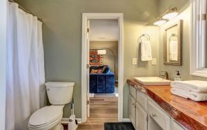 a bathroom with a toilet and a sink at Vista Haven - Mountain Views and Fireplace and Big Screen TVs and Extras in Jasper