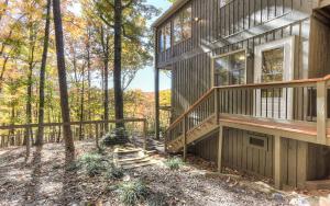 a house in the woods with a deck and stairs at Vista Haven - Mountain Views and Fireplace and Big Screen TVs and Extras in Jasper