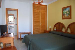 Postel nebo postele na pokoji v ubytování Hotel Antonio Conil