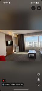 a hotel room with a table in a room at 50100 Event Hall in Ongon
