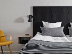 A bed or beds in a room at Rungstedgaard