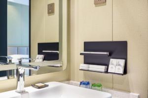 Μια τηλεόραση ή/και κέντρο ψυχαγωγίας στο Borrman Hotel Xiamen Xiang'an Maxiang +106 φωτογραφίες