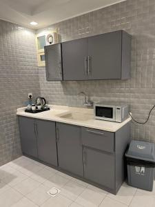 Η κουζίνα ή μικρή κουζίνα στο فندق قمم بارك 3 Qimam Park Hotel