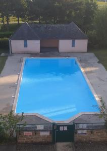 an overhead view of a large blue swimming pool at Arzon in Arzon