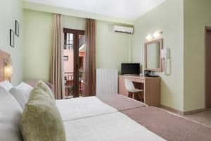 Gulta vai gultas numurā naktsmītnē Hotel Leto Delphi