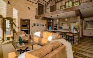 a living room with a couch and a table at Smoky Mountain Skies in Gatlinburg