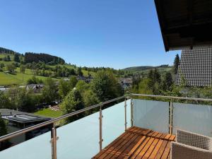 a balcony with a view of a valley at Ferienhaus Bocks 73 in Bad Berleburg