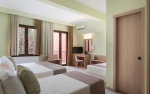 Gulta vai gultas numurā naktsmītnē Hotel Leto Delphi