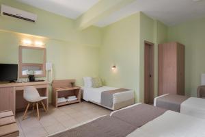 Gulta vai gultas numurā naktsmītnē Hotel Leto Delphi