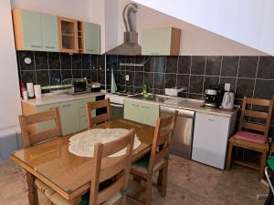 Kuchyňa alebo kuchynka v ubytovaní Apartman GRL