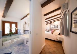 Postel nebo postele na pokoji v ubytování B&B Maiurè