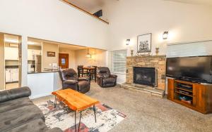 a living room with a couch and a fireplace at Mountain Bliss in Gatlinburg