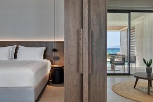Voodi või voodid majutusasutuse Mosay All Suite Hotel toas