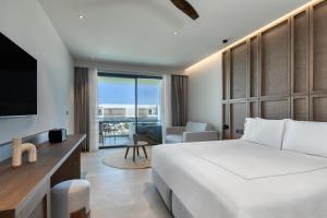 Voodi või voodid majutusasutuse Mosay All Suite Hotel toas