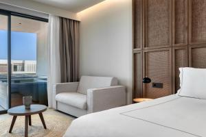 Voodi või voodid majutusasutuse Mosay All Suite Hotel toas