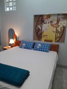 Ένα ή περισσότερα κρεβάτια σε δωμάτιο στο Trump Homestay - Khu bờ kè biển Phước Hải +7 φωτογραφίες