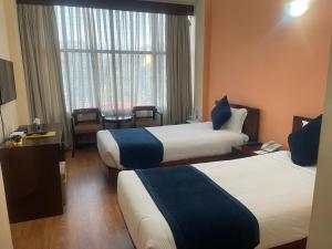 Letto o letti in una camera di Airport Hotel