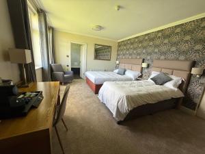 Letto o letti in una camera di Ring of Kerry Hotel