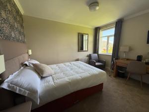 Letto o letti in una camera di Ring of Kerry Hotel
