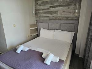 Postel nebo postele na pokoji v ubytování Hotel Pini
