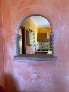 Kuchyň nebo kuchyňský kout v ubytování I Mari Di Gallura Suites and Rooms